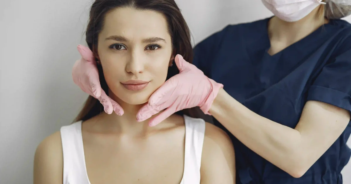 woman with hands on her face